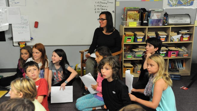 Lyn VanOver and her class at ArtSpace Charter School in Swannanoa rehearse for a play during class on Nov. 7.