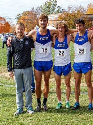 Britten Olinger, who stands on the far left, takes a picture with track and field athletes from Eastern Mennonite University at a meet. He coached track and field at EMU from 2011-16 before he began coaching at Montreat College in July 2016. Olinger was paralyzed from the chest down after a car accident Feb. 27 in Black Mountain.