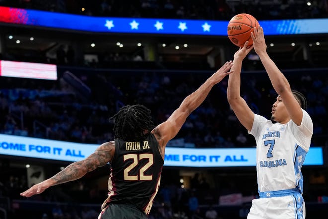 North Carolina guard Seth Trimble (7) shoots over Florida State guard Darin Green Jr. (22) during the first half of the Atlantic Coast Conference quarterfinals NCAA college basketball tournament game Thursday, March 14, 2024, in Washington. (AP Photo/Susan Walsh)