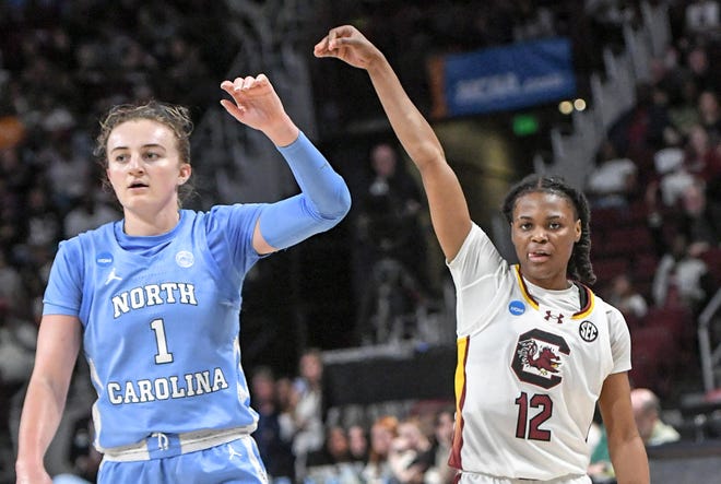 South Carolina guard MiLaysia Fulwiley (12) reacts after making a three-point shot near University of North Carolina guard Alyssa Ustby (1) during the third quarter of the second round NCAA Women's Basketball Tournament game at the Colonial Life Center in Columbia, S.C. Sunday, March 24, 2024.
