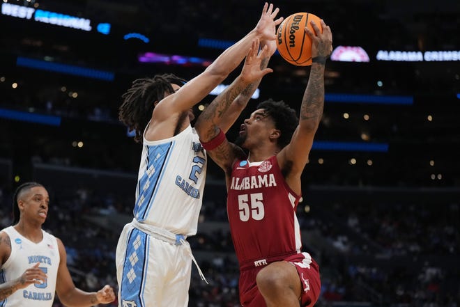 Mar 28, 2024; Los Angeles, CA, USA; Alabama Crimson Tide guard Aaron Estrada (55) shoots against North Carolina Tar Heels guard Elliot Cadeau (2) in the first half in the semifinals of the West Regional of the 2024 NCAA Tournament at Crypto.com Arena. Mandatory Credit: Kirby Lee-USA TODAY Sports