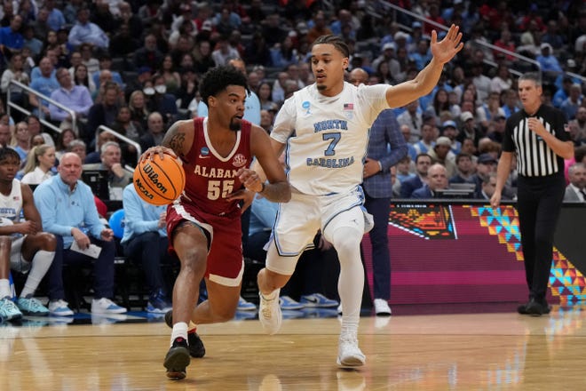 Mar 28, 2024; Los Angeles, CA, USA; Alabama Crimson Tide guard Aaron Estrada (55) controls the ball against North Carolina Tar Heels guard Seth Trimble (7) in the first half in the semifinals of the West Regional of the 2024 NCAA Tournament at Crypto.com Arena. Mandatory Credit: Kirby Lee-USA TODAY Sports