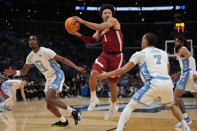 Mar 28, 2024; Los Angeles, CA, USA; Alabama Crimson Tide guard Mark Sears (1) controls the ball against North Carolina Tar Heels guard Seth Trimble (7) in the first half in the semifinals of the West Regional of the 2024 NCAA Tournament at Crypto.com Arena. Mandatory Credit: Kirby Lee-USA TODAY Sports