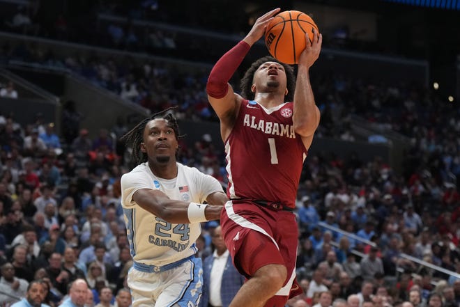 Mar 28, 2024; Los Angeles, CA, USA; Alabama Crimson Tide guard Mark Sears (1) shoots against North Carolina Tar Heels forward Jae'Lyn Withers (24) in the first half in the semifinals of the West Regional of the 2024 NCAA Tournament at Crypto.com Arena. Mandatory Credit: Kirby Lee-USA TODAY Sports