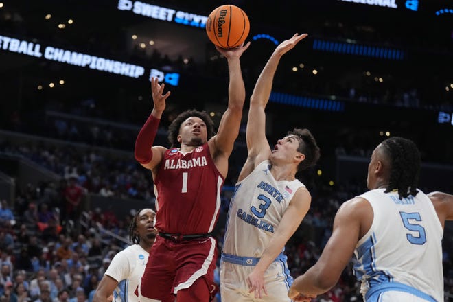 Mar 28, 2024; Los Angeles, CA, USA; Alabama Crimson Tide guard Mark Sears (1) shoots against North Carolina Tar Heels guard Cormac Ryan (3) in the first half in the semifinals of the West Regional of the 2024 NCAA Tournament at Crypto.com Arena. Mandatory Credit: Kirby Lee-USA TODAY Sports