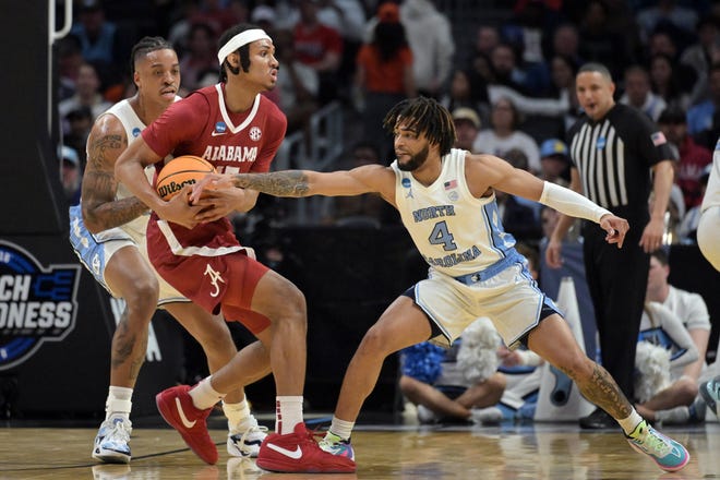 Mar 28, 2024; Los Angeles, CA, USA; Alabama Crimson Tide forward Jarin Stevenson (15) controls the ball against North Carolina Tar Heels guard RJ Davis (4) in the first half in the semifinals of the West Regional of the 2024 NCAA Tournament at Crypto.com Arena. Mandatory Credit: Jayne Kamin-Oncea-USA TODAY Sports