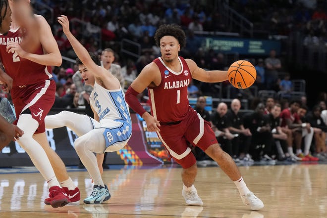 Mar 28, 2024; Los Angeles, CA, USA; Alabama Crimson Tide guard Mark Sears (1) controls the ball against North Carolina Tar Heels guard Cormac Ryan (3) in the first half in the semifinals of the West Regional of the 2024 NCAA Tournament at Crypto.com Arena. Mandatory Credit: Kirby Lee-USA TODAY Sports