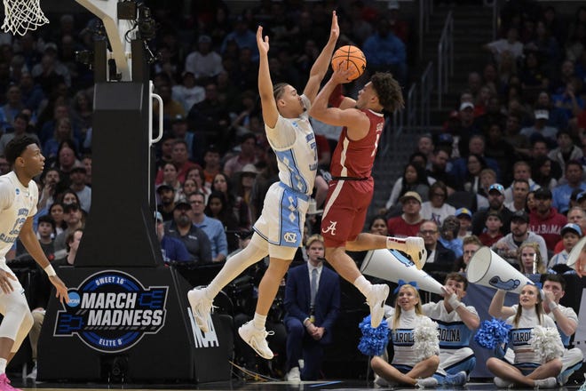 Mar 28, 2024; Los Angeles, CA, USA; Alabama Crimson Tide guard Mark Sears (1) shoots against North Carolina Tar Heels guard Seth Trimble (7) in the first half in the semifinals of the West Regional of the 2024 NCAA Tournament at Crypto.com Arena. Mandatory Credit: Jayne Kamin-Oncea-USA TODAY Sports