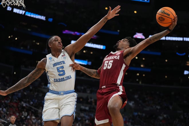 Mar 28, 2024; Los Angeles, CA, USA; Alabama Crimson Tide guard Aaron Estrada (55) shoots against North Carolina Tar Heels forward Armando Bacot (5) in the first half in the semifinals of the West Regional of the 2024 NCAA Tournament at Crypto.com Arena. Mandatory Credit: Kirby Lee-USA TODAY Sports