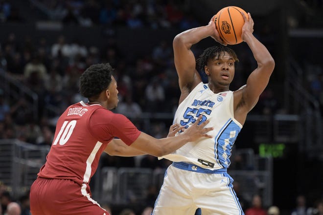 Mar 28, 2024; Los Angeles, CA, USA; North Carolina Tar Heels forward Harrison Ingram (55) controls the ball against Alabama Crimson Tide forward Mouhamed Dioubate (10) in the first half in the semifinals of the West Regional of the 2024 NCAA Tournament at Crypto.com Arena. Mandatory Credit: Jayne Kamin-Oncea-USA TODAY Sports