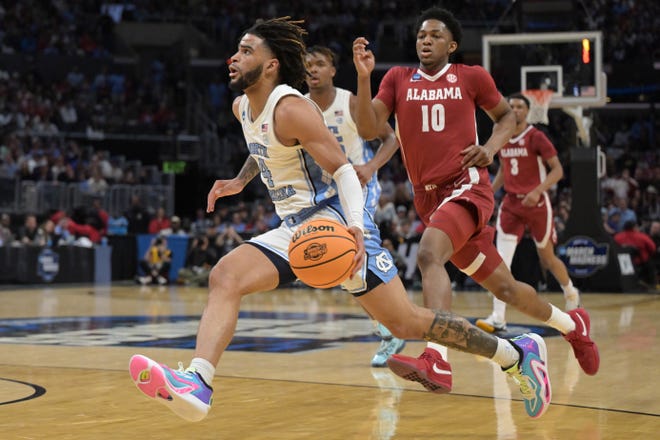 Mar 28, 2024; Los Angeles, CA, USA; North Carolina Tar Heels guard RJ Davis (4) controls the ball against the Alabama Crimson Tide in the first half in the semifinals of the West Regional of the 2024 NCAA Tournament at Crypto.com Arena. Mandatory Credit: Jayne Kamin-Oncea-USA TODAY Sports