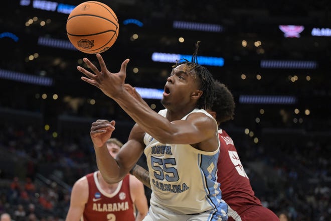 Mar 28, 2024; Los Angeles, CA, USA; North Carolina Tar Heels forward Harrison Ingram (55) loses control of the ball against Alabama Crimson Tide guard Aaron Estrada (55) in the first half in the semifinals of the West Regional of the 2024 NCAA Tournament at Crypto.com Arena. Mandatory Credit: Jayne Kamin-Oncea-USA TODAY Sports