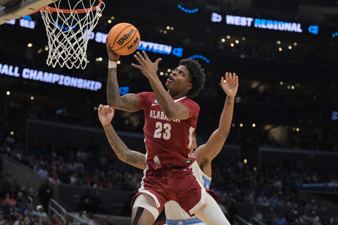 Mar 28, 2024; Los Angeles, CA, USA; Alabama Crimson Tide forward Nick Pringle (23) shoots against North Carolina Tar Heels forward Armando Bacot (5) in the second half in the semifinals of the West Regional of the 2024 NCAA Tournament at Crypto.com Arena. Mandatory Credit: Jayne Kamin-Oncea-USA TODAY Sports
