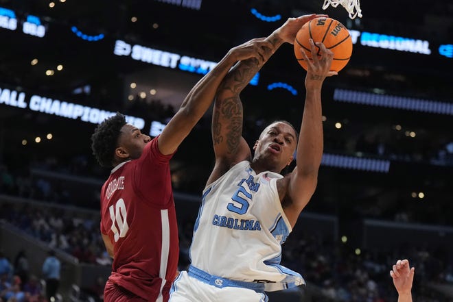 Mar 28, 2024; Los Angeles, CA, USA; North Carolina Tar Heels forward Armando Bacot (5) and Alabama Crimson Tide forward Mouhamed Dioubate (10) fight for the rebound in the second half in the semifinals of the West Regional of the 2024 NCAA Tournament at Crypto.com Arena. Mandatory Credit: Kirby Lee-USA TODAY Sports