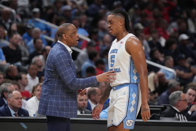 Mar 28, 2024; Los Angeles, CA, USA; North Carolina Tar Heels head coach Hubert Davis talks with forward Armando Bacot (5) in the first half against the Alabama Crimson Tide in the semifinals of the West Regional of the 2024 NCAA Tournament at Crypto.com Arena. Mandatory Credit: Kirby Lee-USA TODAY Sports