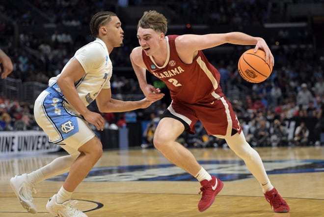 Mar 28, 2024; Los Angeles, CA, USA; Alabama Crimson Tide forward Grant Nelson (2) controls the ball against North Carolina Tar Heels guard Seth Trimble (7) in the second half in the semifinals of the West Regional of the 2024 NCAA Tournament at Crypto.com Arena. Mandatory Credit: Jayne Kamin-Oncea-USA TODAY Sports
