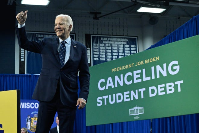 Madison, Wisconsin | 
President Joe Biden gestures a thumbs up after speaking about student loan debt relief at Madison Area Technical College in Madison, Wisconsin on April 8, 2024.