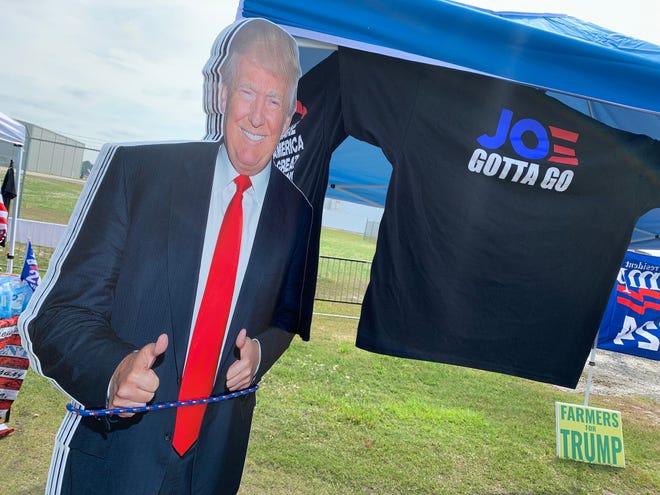 A cardboard cutout of Donald Trump is just one of the many items for sale at a rally Saturday, April 20, 2024.