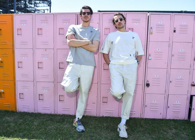 Brothers Julien deBie (left) and Thomas de Bie from Parallelle pose in matching neutral outfits.