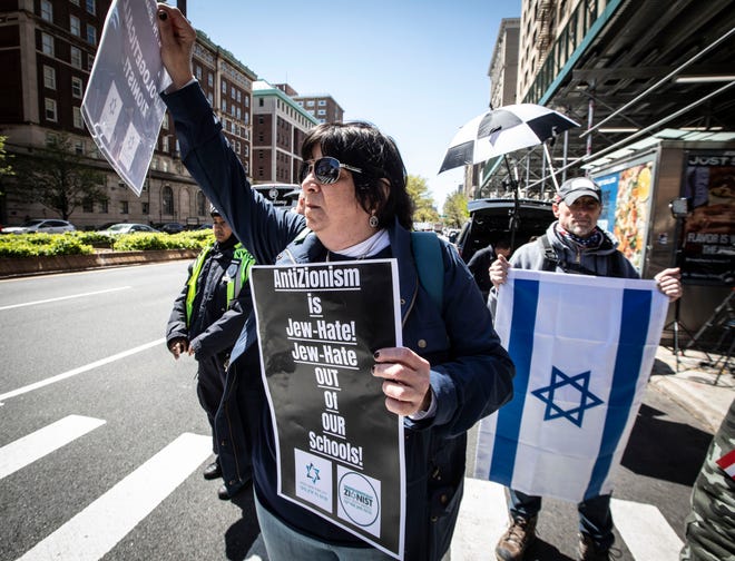 Pro-Israel supporters Karen Lichtbraun of Manhattan and Josh Rosenthal of Freehold, NJ. stand across the street from Columbia University in Manhattan April 22, 2024.