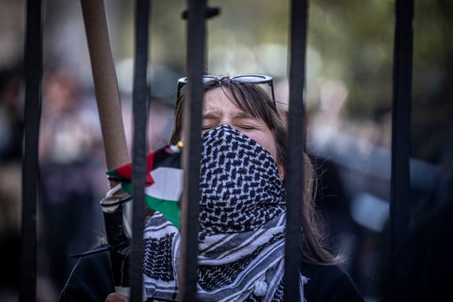 A Columbia University student takes part in an anti-Israel protest inside the gates the school in Manhattan April 22, 2024.