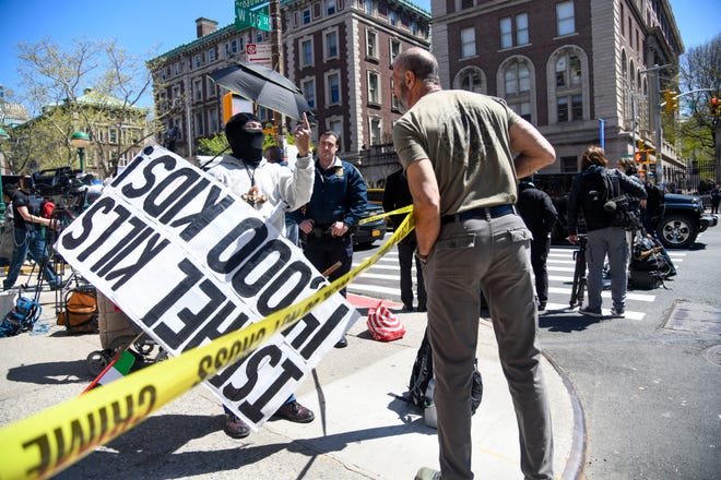 Protestors gather on the streets near the Columbia University campus in New York on April 22, 2024, after school officials closed the campus and made all classes remote. This came after hundreds of pro-Palestinian protestors took over large parts of the campus last week.