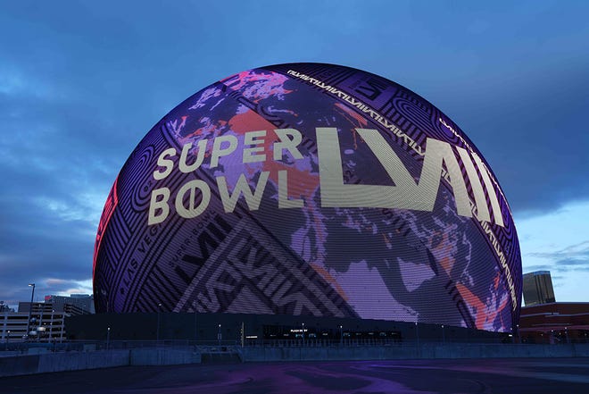 Super Bowl 58 graphics are projected onto the Sphere.