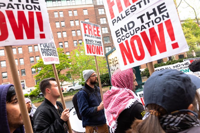 Pro-Palestinian protesters hold a small rally outside of Columbia University on April 24, 2024 in New York City. School administrators and pro-Palestinian, student protesters made progress on negations after the school set a midnight deadline for students to disband the encampment. The students agreed to remove a significant number of the tents that have been erected on the lawn, and ensured that non-students would leave, and bar discriminatory or harassing language among the protesters.