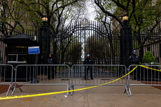 NYPD officers stand by the entrance to Columbia University on April 24, 2024 in New York City.