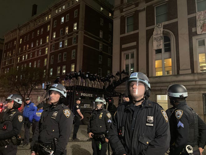 Police in riot gear enter Hamilton Hall on Columbia University in New York on April 30, 2024.Students at Columbia were among the first to embrace the pro-Palestinian campus encampment movement, which has spread to a number of universities across the United States.