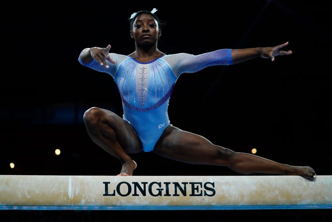 Oct. 5: Simone Biles performs on the balance beam during the qualifying session at the FIG Artistic Gymnastics World Championships in Stuttgart, southern Germany.