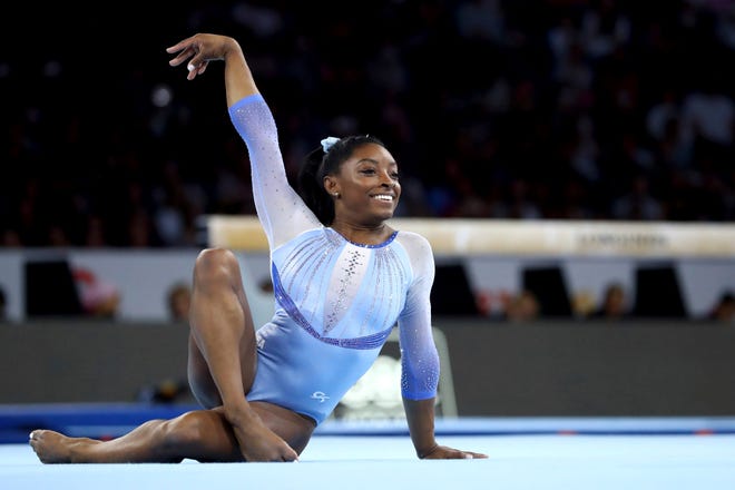 Oct. 5: Simone Biles performs on the floor exercise beam during qualifying sessions for the FIG Artistic Gymnastics World Championships in Stuttgart, Germany.