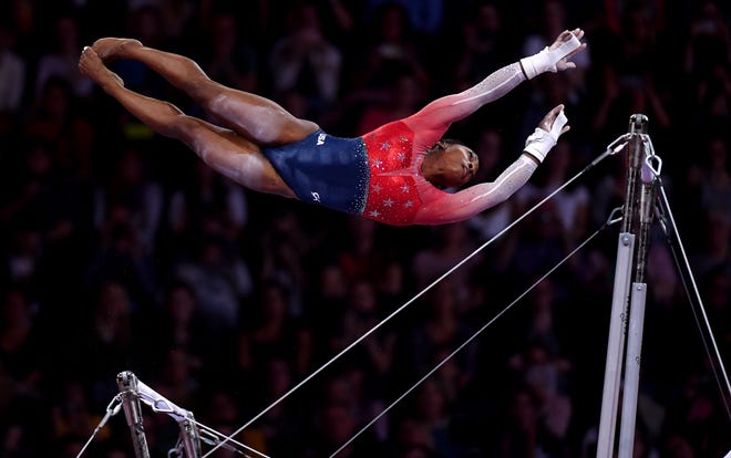 Oct. 8: Simone Biles performs on the uneven bars during the women's team finals on Day 5 of FIG Artistic Gymnastics World Championships.