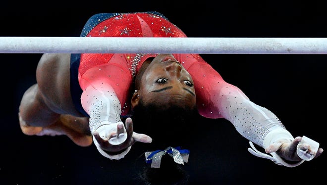 Oct. 8: Simone Biles performs on the uneven bars during the women's team final.