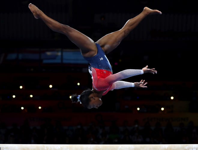 Oct. 8: Simone Biles performs on the balance beam during women's team final at the Gymnastics World Championships in Stuttgart, Germany.