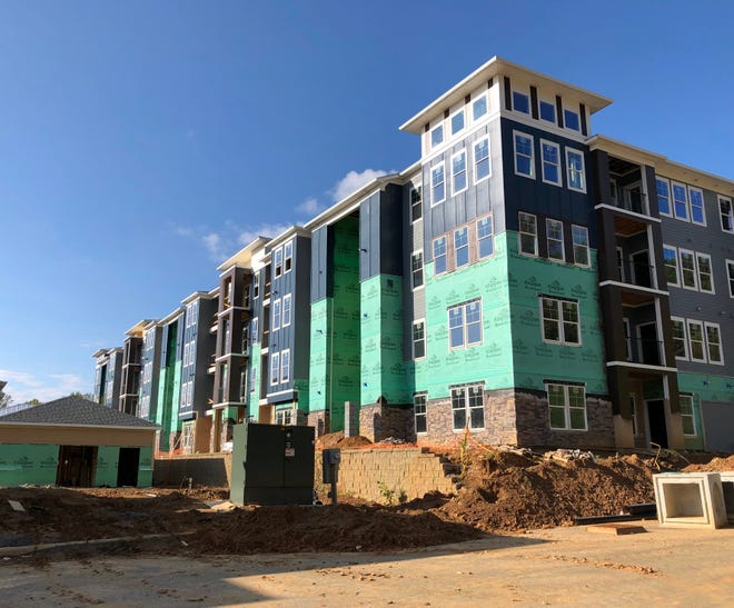 The 272-unit Hawthorne at Mills Gap apartment complex will be finished this July. This photo, taken last winter, shows one of the units under construction. The development will include 41 affordable units.