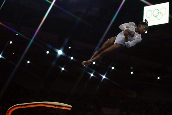 Simone Biles performs on the vault during the women's all-around final.