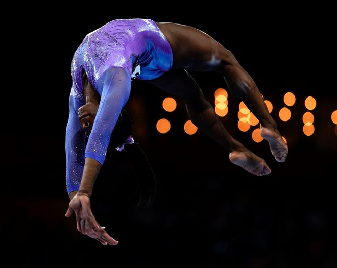 Oct. 13: USA's Simone Biles performs on the beam during the apparatus finals.