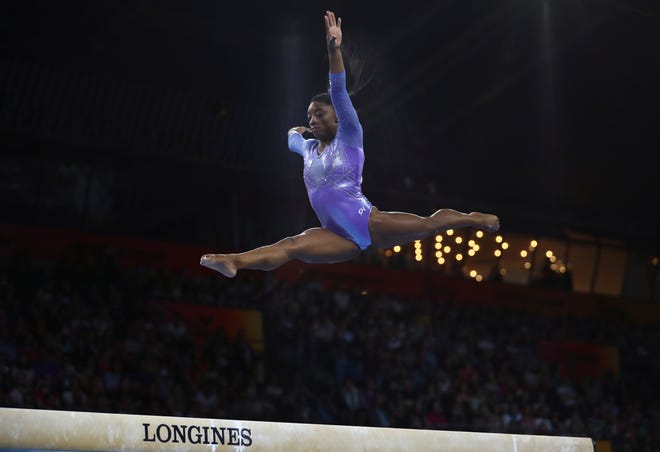 Oct. 13: Gold medalist Simone Biles of the United States performs on the balance beam in the women's apparatus finals.