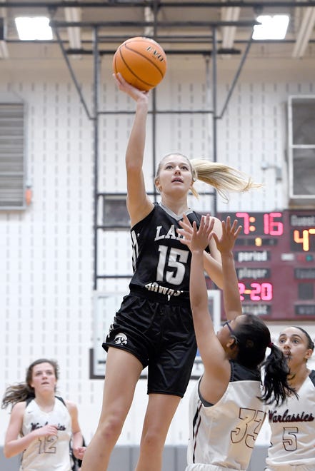 North Buncombe's Karlyn Pickens goes up for a shot over Owen's Mia McMurry during their game at Owen High School on Jan. 2, 2020.