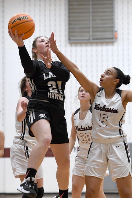 North Buncombe's Cheyenne Cable goes up for a shot against Owen's Sarah Kahlil during their game at Owen High School on Jan. 2, 2020.