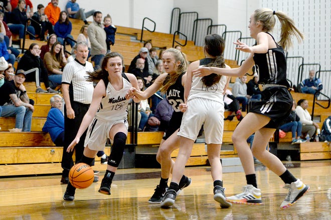 Owen's Carly Hancock makes her way around North Buncombe's 23 as she drives toward the basket during their game at Owen High School on Jan. 2, 2020.