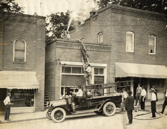 The Black Mountain Fire Department battles a fire on Cherry Street in 1923.