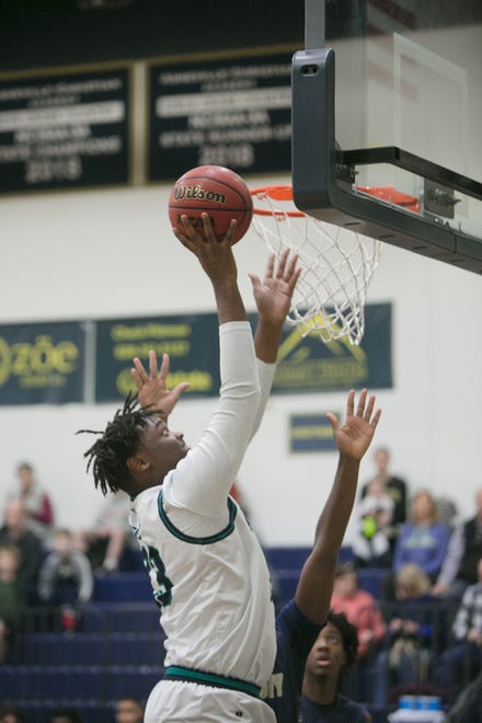 Asheville Christian Academy's Trelin Harper goes for a layup ACA's boys play Hickory Grove Christian in quarterfinal playoff action on Feb. 15, 2020, at ACA in Swannanoa. ACA took the win with a final score of 71-69.
