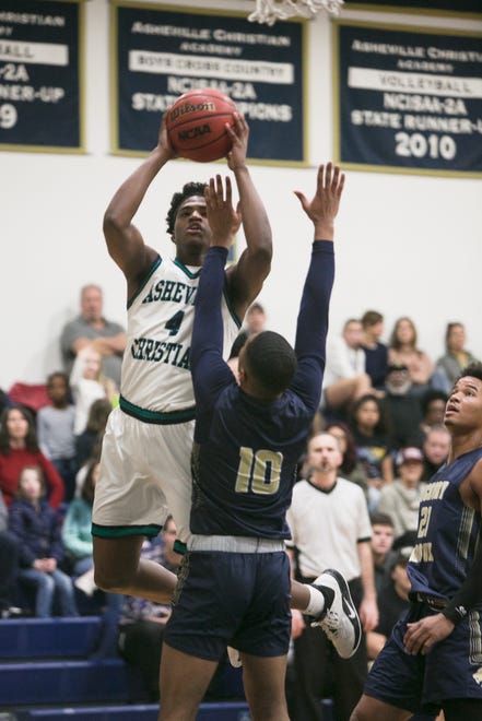 Asheville Christian Academy's Solomon Todd tries to score during the Lions' playoff game against Hickory Grove Christian on Feb. 15, 2020, in Swannanoa.
