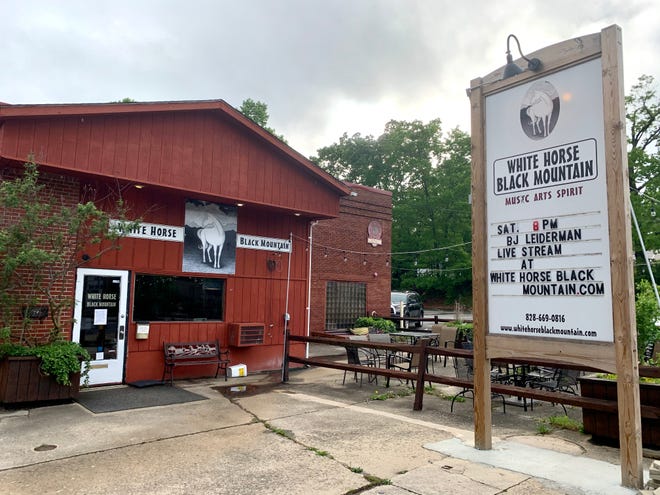 A sign outside of White Horse Black Mountain advertises a livestream event while the venue remains closed amid the coronavirus on May 21.