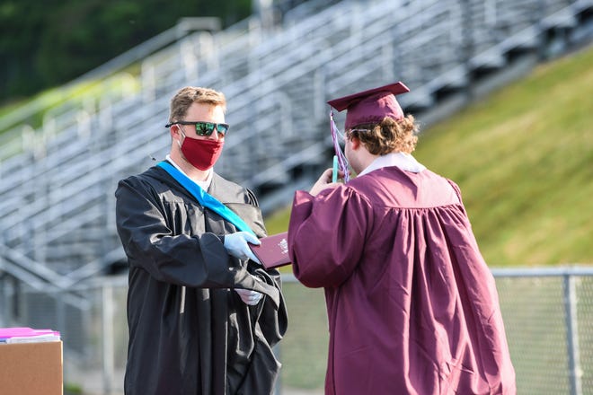Owen High seniors picked up their diplomas in a graduation ceremony June 6, 2020.