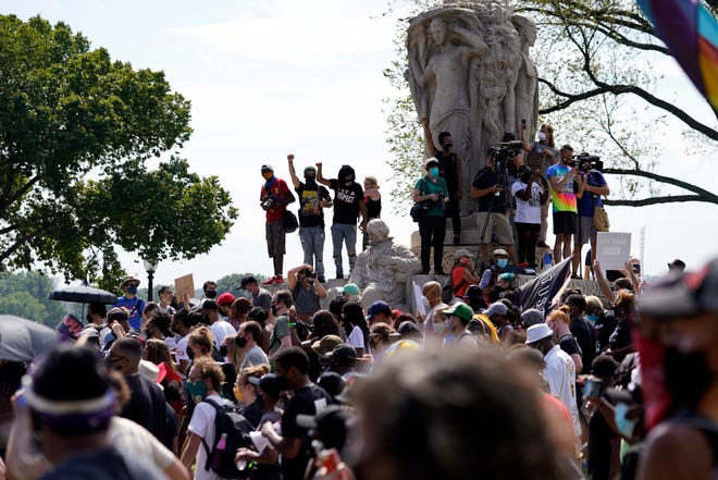 People march from the Lincoln Memorial to the Martin Luther King Jr. Memorial during the March on Washington, Friday Aug. 28, 2020, in Washington.