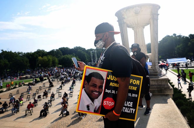 Sean Green, brother of Ronald Greene, listens to speakers at the Lincoln Memorial during the March on Washington August 28, 2020 in Washington. Ronald Greene died in police custody following a high-speed chase in Louisiana in 2019.