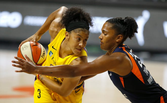Second round: Los Angeles Sparks forward Candace Parker (3) looks to make a move on Connecticut Sun forward Alyssa Thomas during their single-elimination game on Sept. 17.
